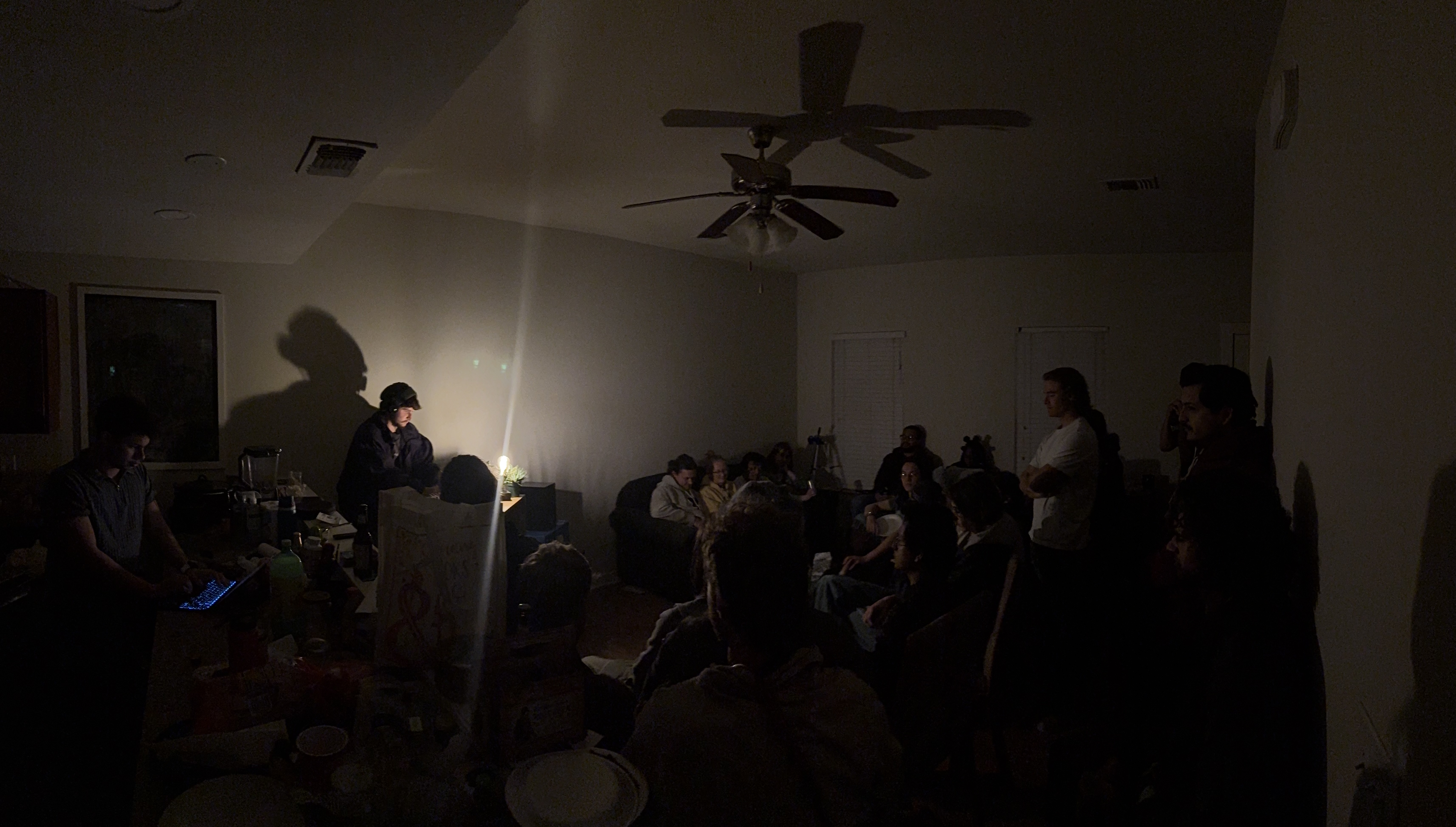 A live performance of Synonyms of a Person before an audience in a dark room